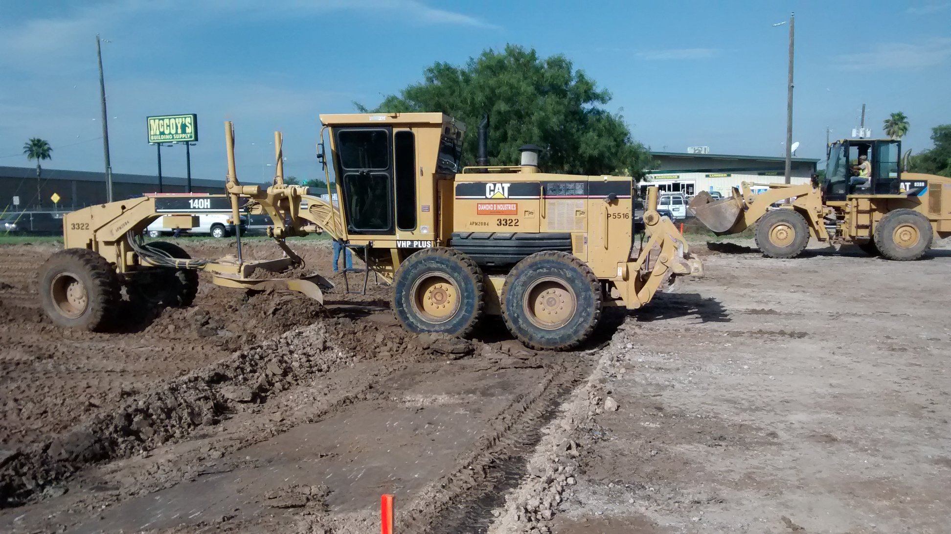 Diamond Eight CAT 140H motor grader — site grading near McCoy's, South Texas